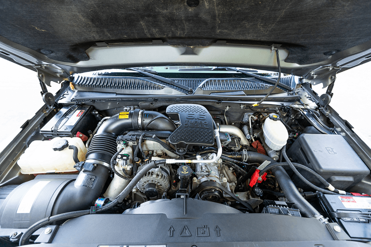 Diesel engine with turbocharger and various components visible, emphasizing maintenance aspects relevant to diesel trucks and performance.